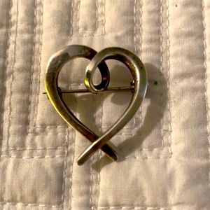 Handmade silver heart pin.